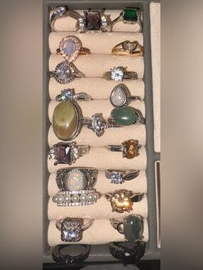 Mixed Gemstone costume rings in various sizes. You get all 22 rings shown.